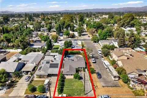 an aerial view of residential houses with outdoor space