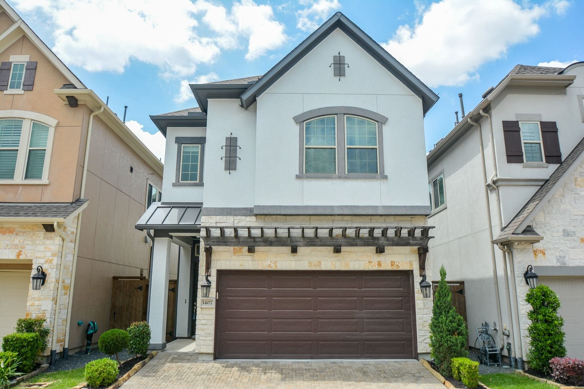 a front view of a house with garage
