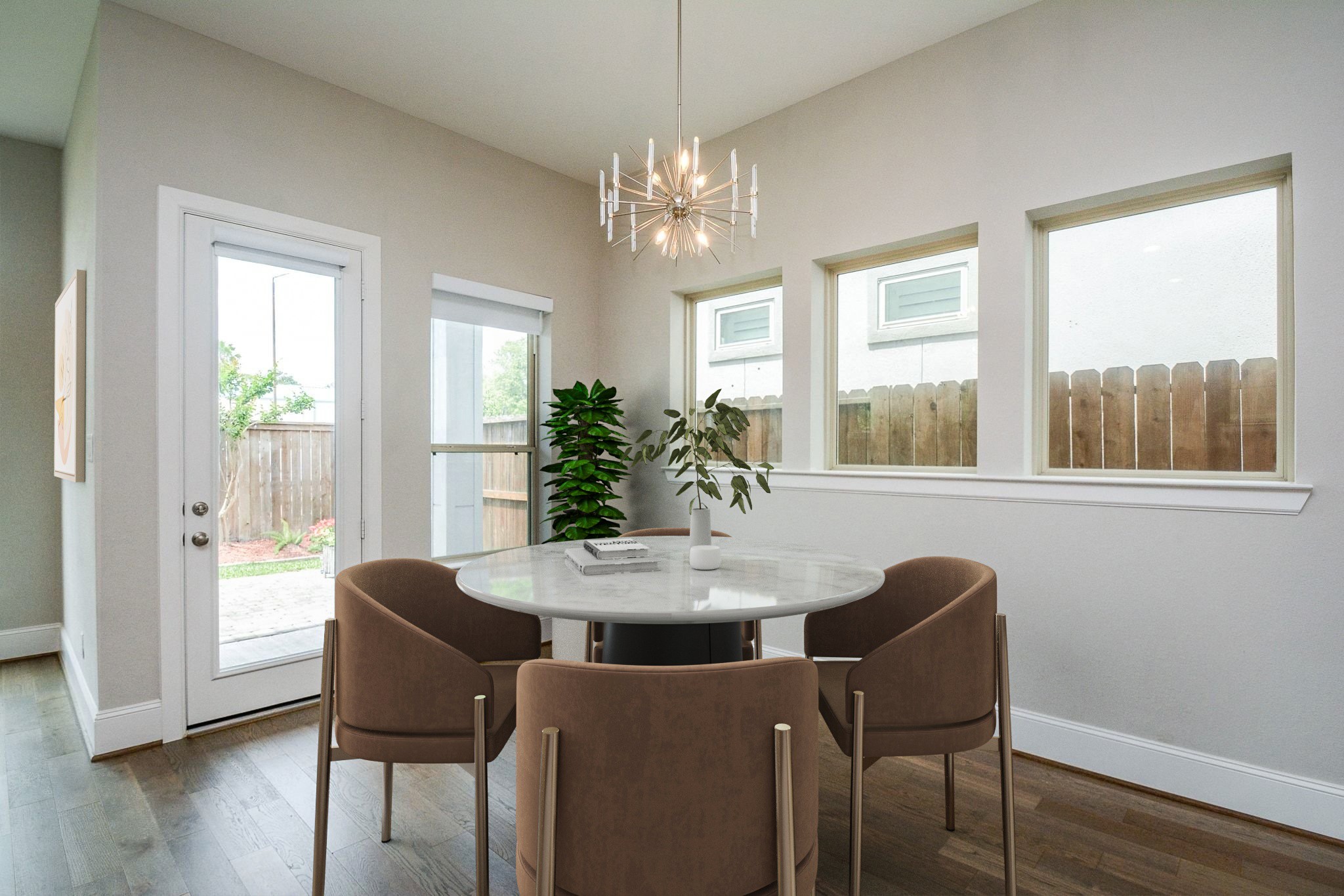 1407 Arkley Way Houston, TX 77055 - Photo 12 of 41 a dining room with furniture potted plants and wooden floor