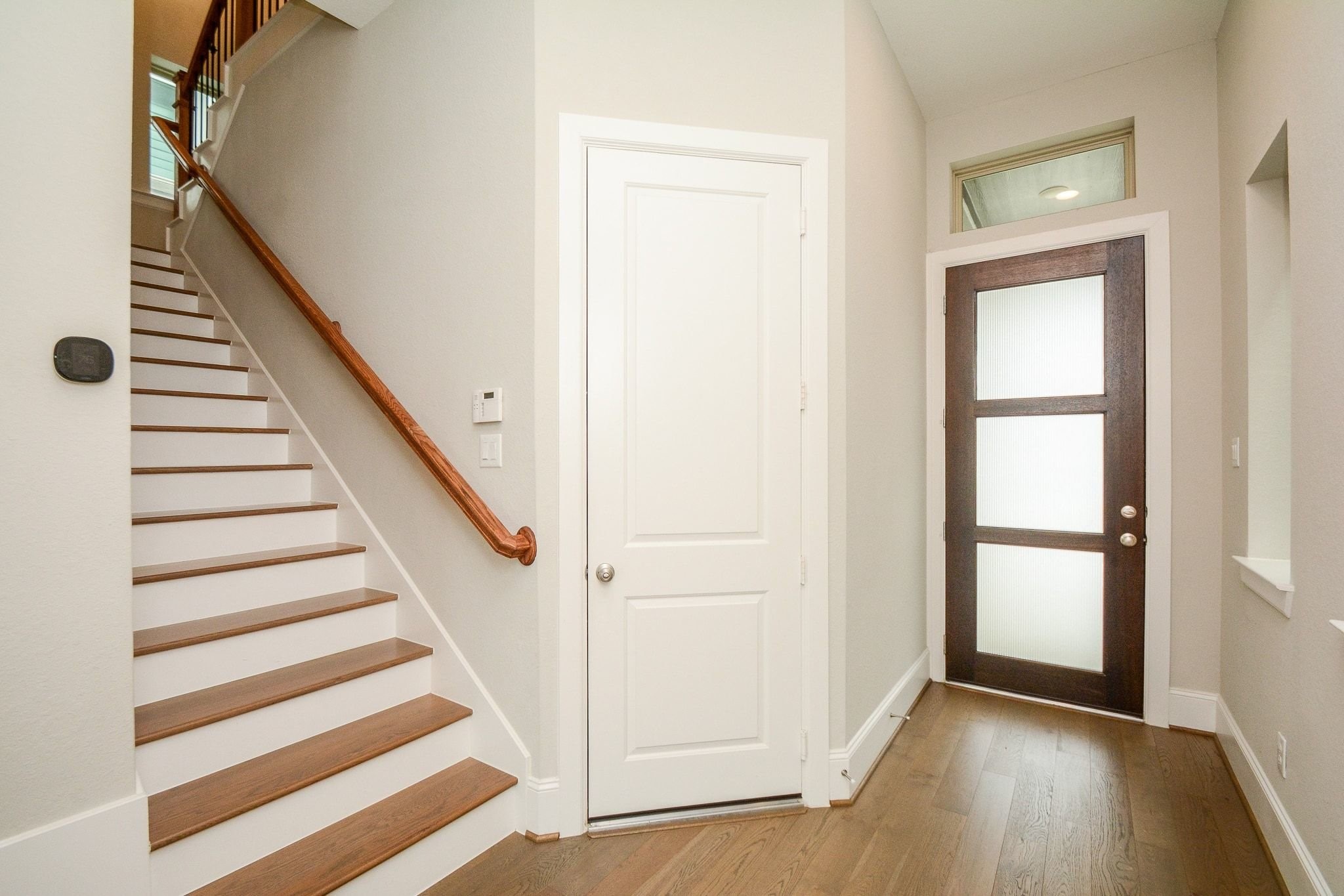 1407 Arkley Way Houston, TX 77055 - Photo 3 of 41 a view of a hallway with wooden floor and entryway