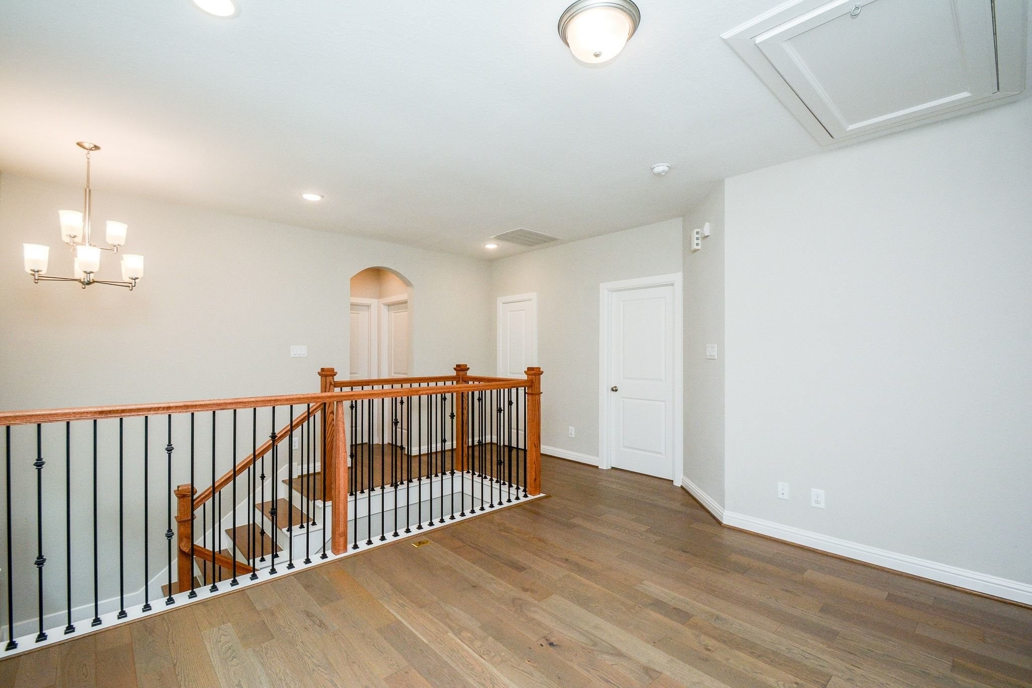 1407 Arkley Way Houston, TX 77055 - Photo 36 of 41 a view of hallway with wooden floor