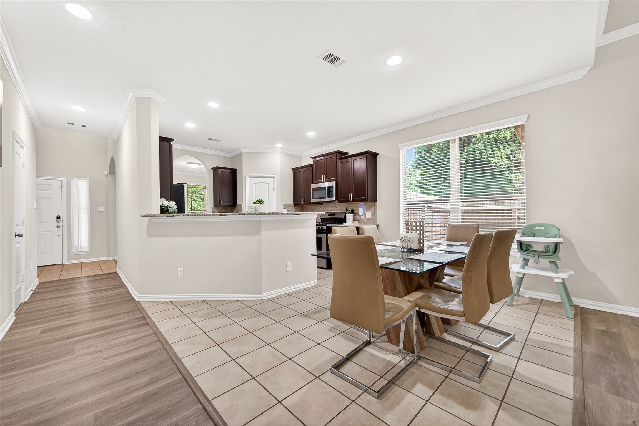 8 Landscape Court Conroe, TX 77301 - Photo 13 of 43 a view of a dining room with furniture window and wooden floor