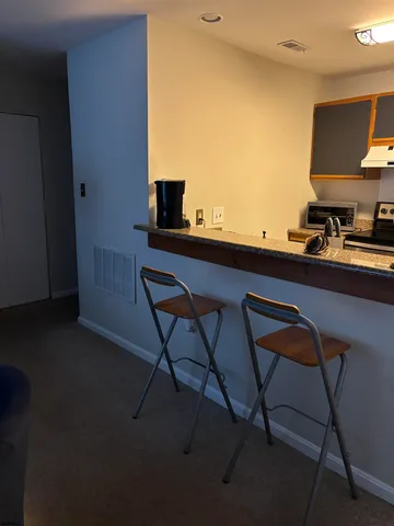 a view of a workspace with furniture