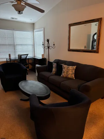 a living room with furniture and a window