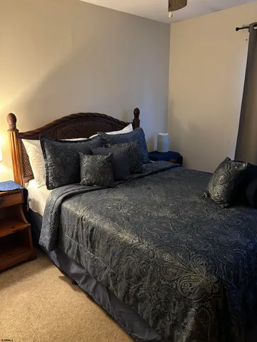 a bedroom with a bed and a mirror