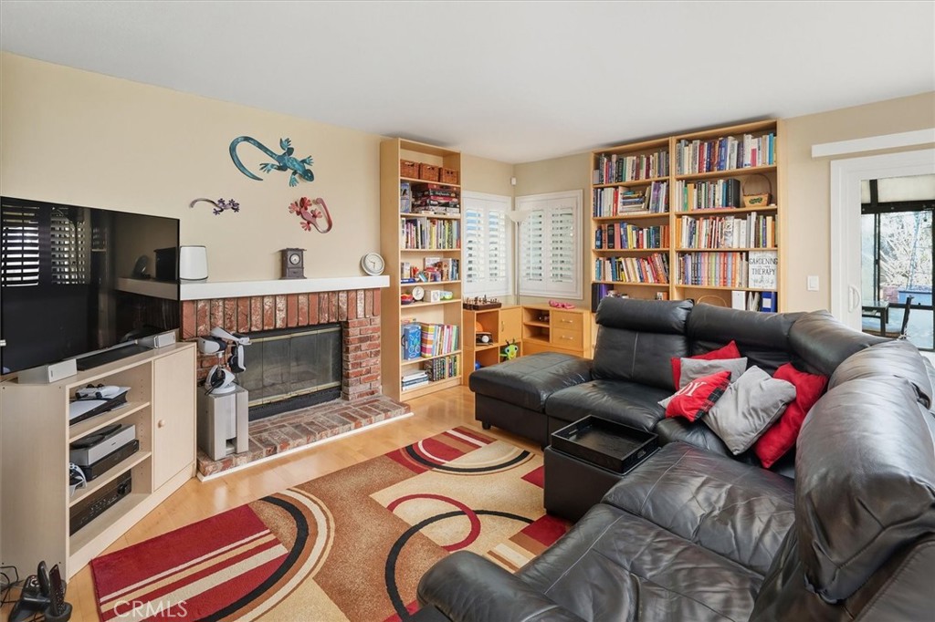 31347 Quail Valley Road Castaic, CA 91384 - Photo 11 of 41 a living room with furniture a flat screen tv and a fireplace