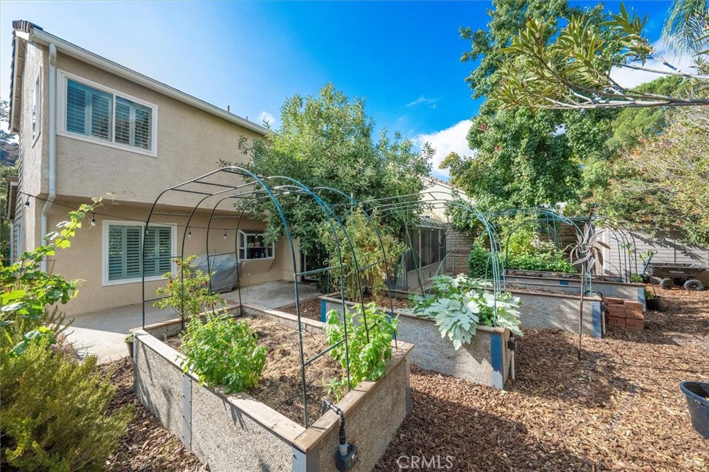 31347 Quail Valley Road Castaic, CA 91384 - Photo 29 of 41 a front view of a house with garden
