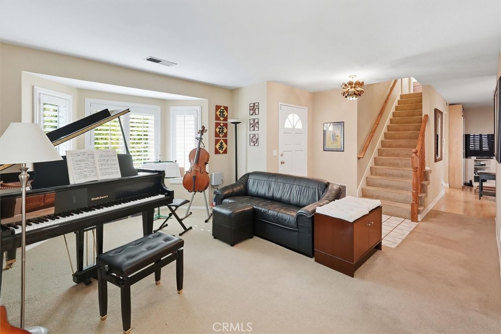 31347 Quail Valley Road Castaic, CA 91384 - Photo 4 of 41 a living room with furniture and a wooden floor