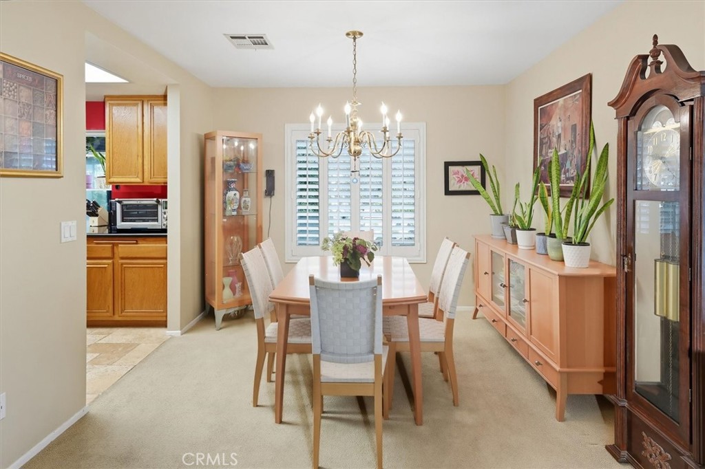 31347 Quail Valley Road Castaic, CA 91384 - Photo 6 of 41 a dining room with furniture a chandelier and window
