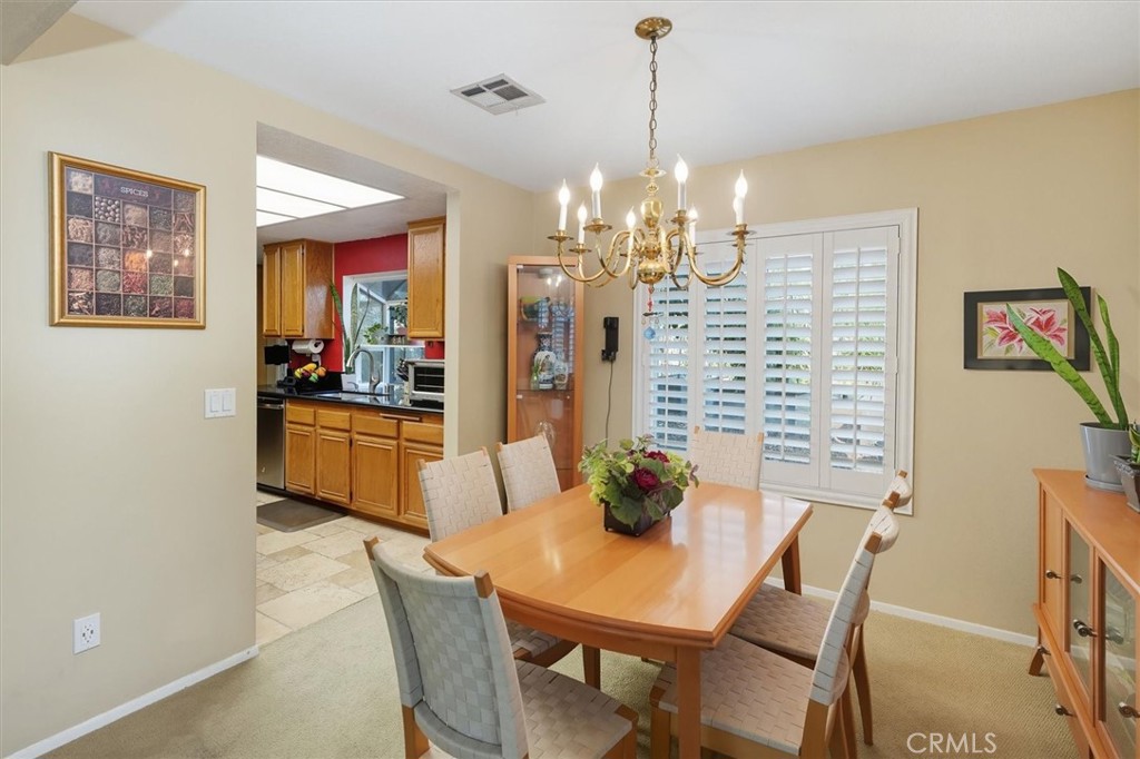 31347 Quail Valley Road Castaic, CA 91384 - Photo 7 of 41 a view of a dining room with furniture and chandelier