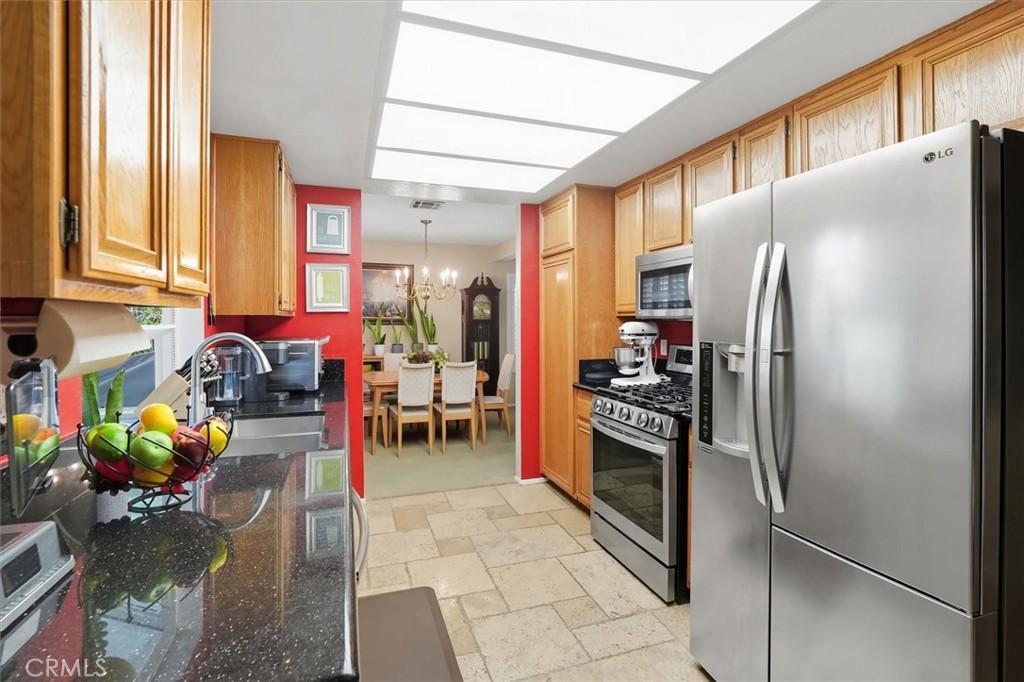 31347 Quail Valley Road Castaic, CA 91384 - Photo 9 of 41 a kitchen with refrigerator and cabinets