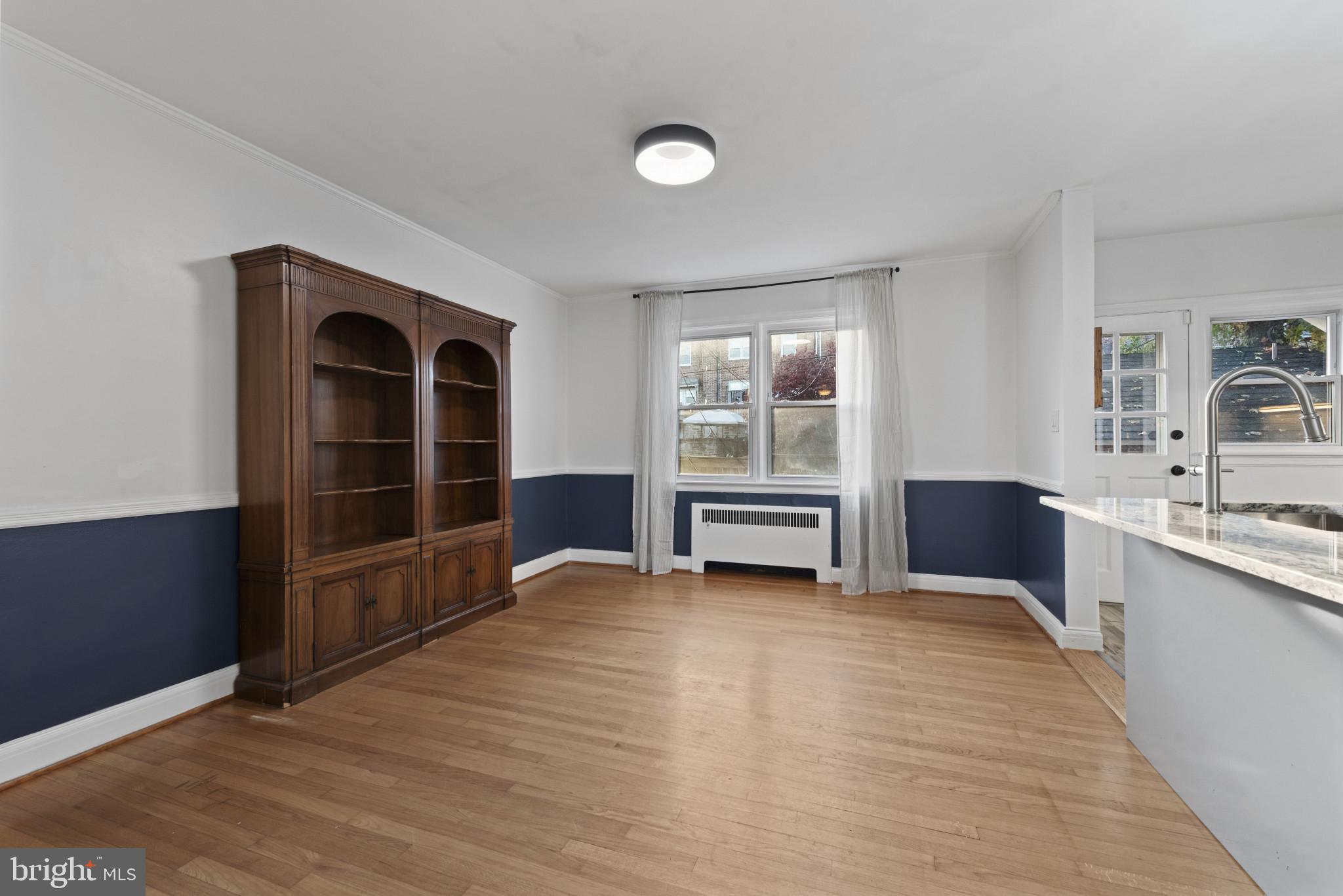 3712 Monterey Road Baltimore, MD 21218 - Photo 12 of 40 a view of a kitchen with wooden floor and a sink