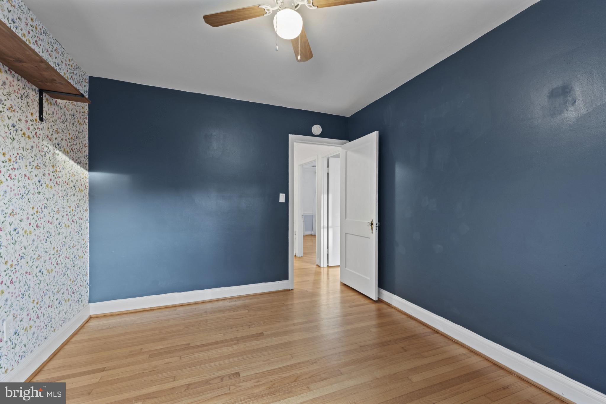 3712 Monterey Road Baltimore, MD 21218 - Photo 24 of 40 a view of an empty room with wooden floor