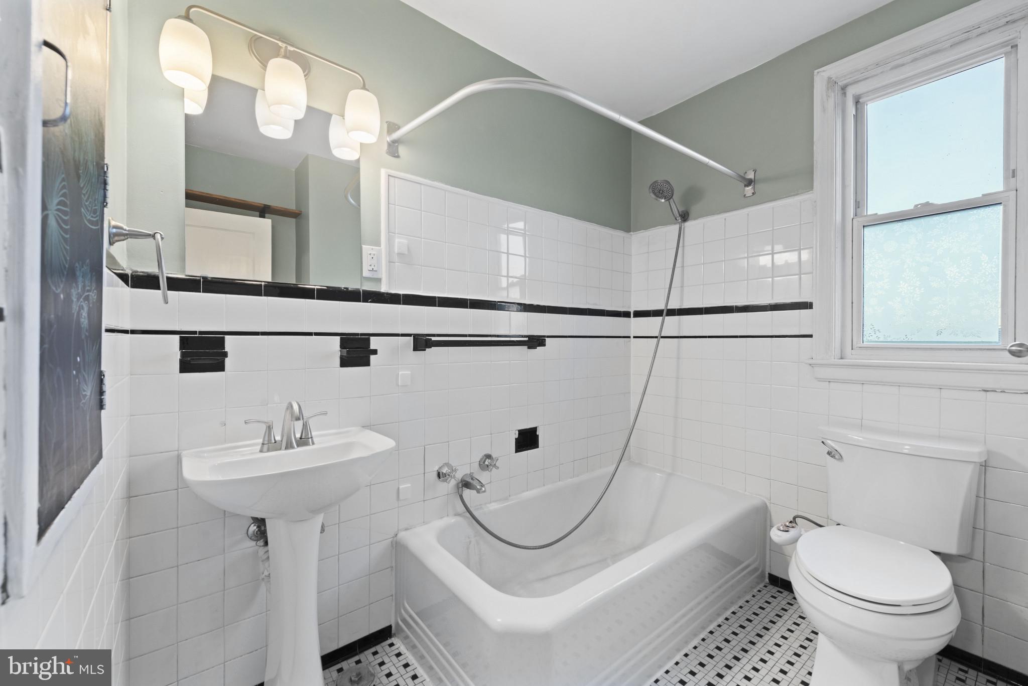 3712 Monterey Road Baltimore, MD 21218 - Photo 25 of 40 a bathroom with a sink toilet and shower