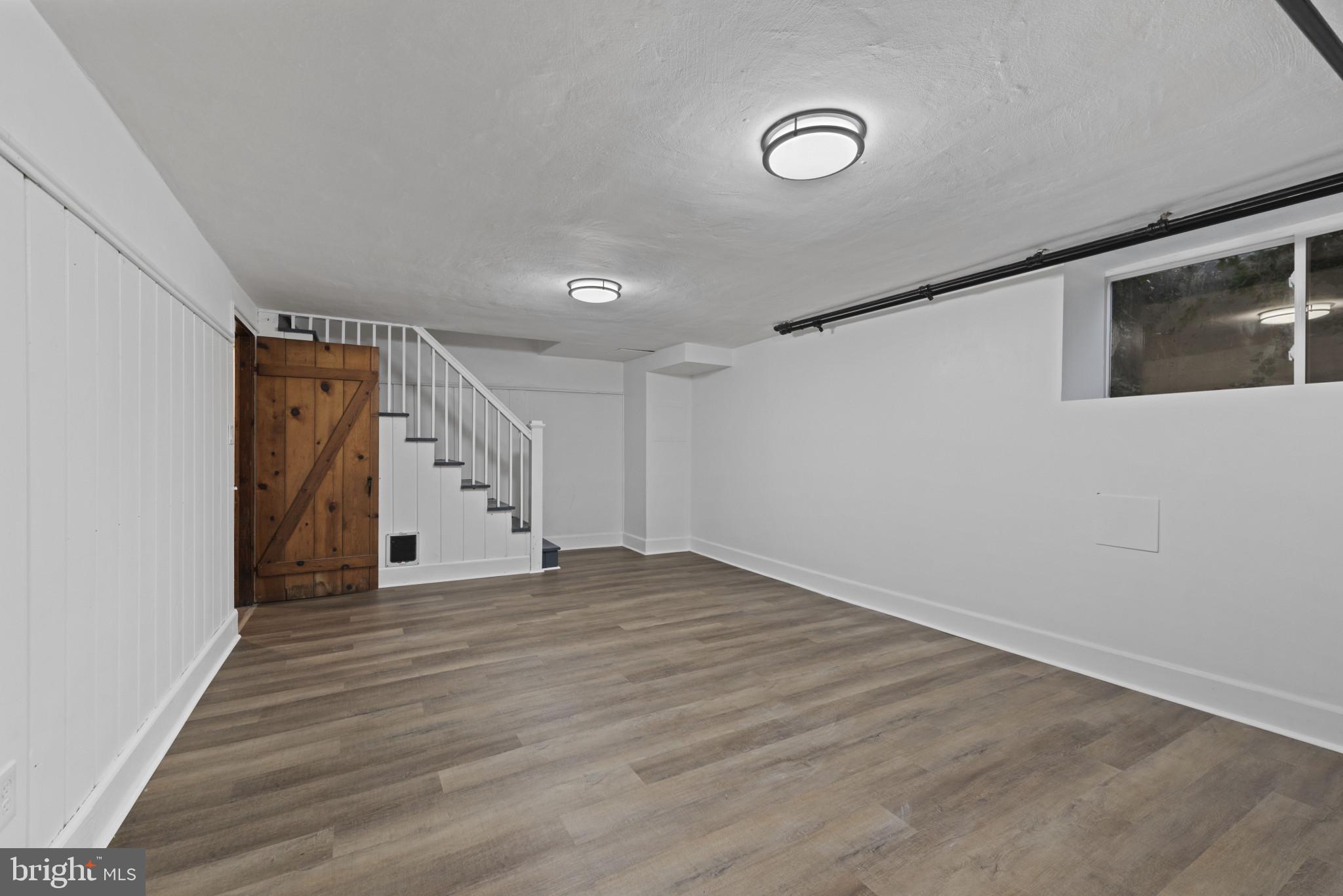 3712 Monterey Road Baltimore, MD 21218 - Photo 27 of 40 a view of empty room with wooden floor