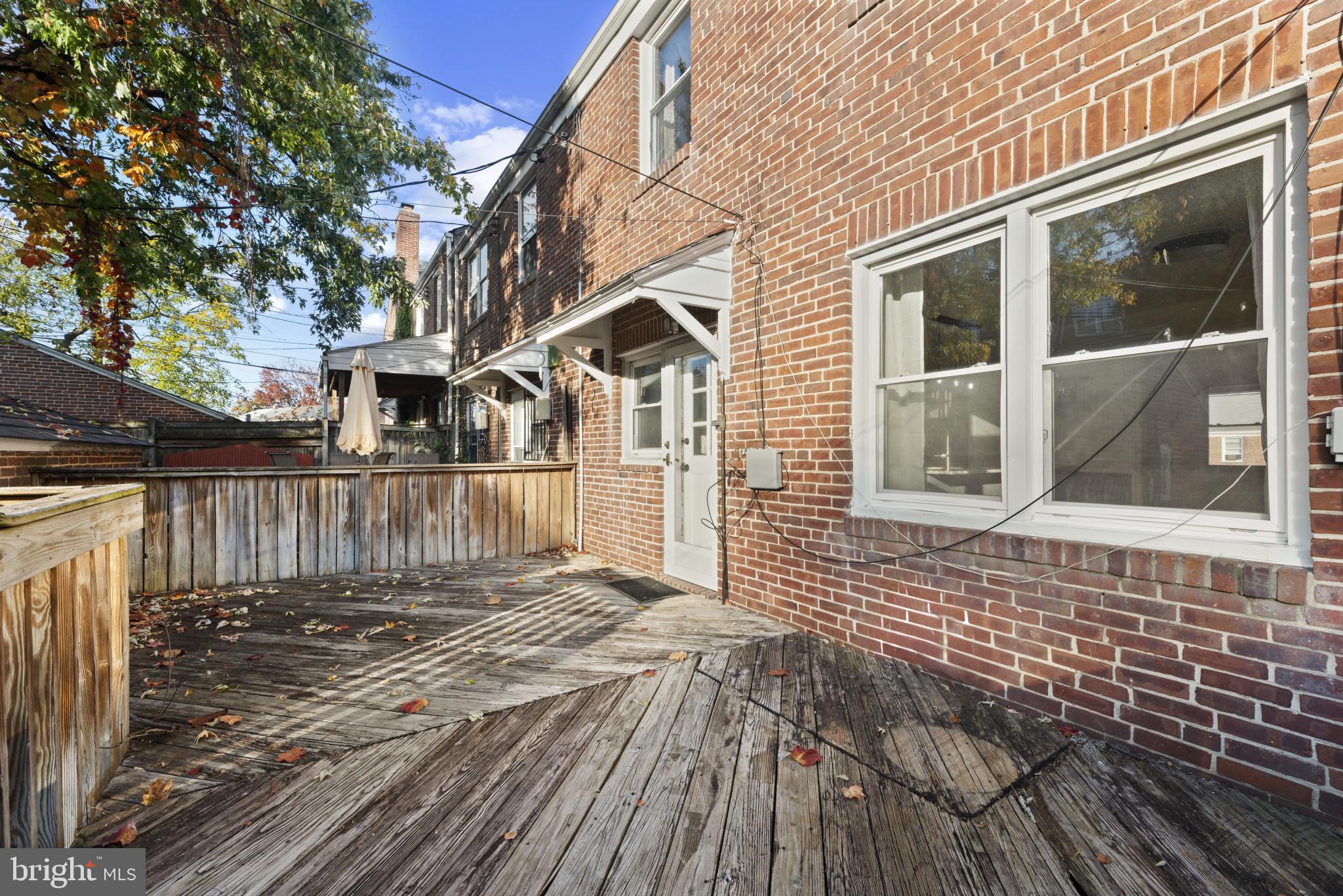 3712 Monterey Road Baltimore, MD 21218 - Photo 32 of 40 a view of a house with a wooden fence