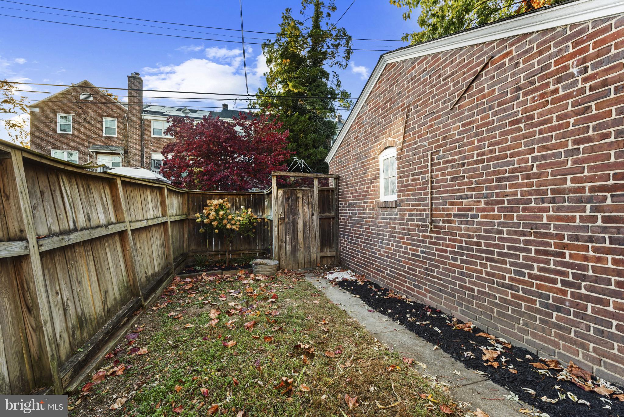 3712 Monterey Road Baltimore, MD 21218 - Photo 34 of 40 a view of a pathway along the building