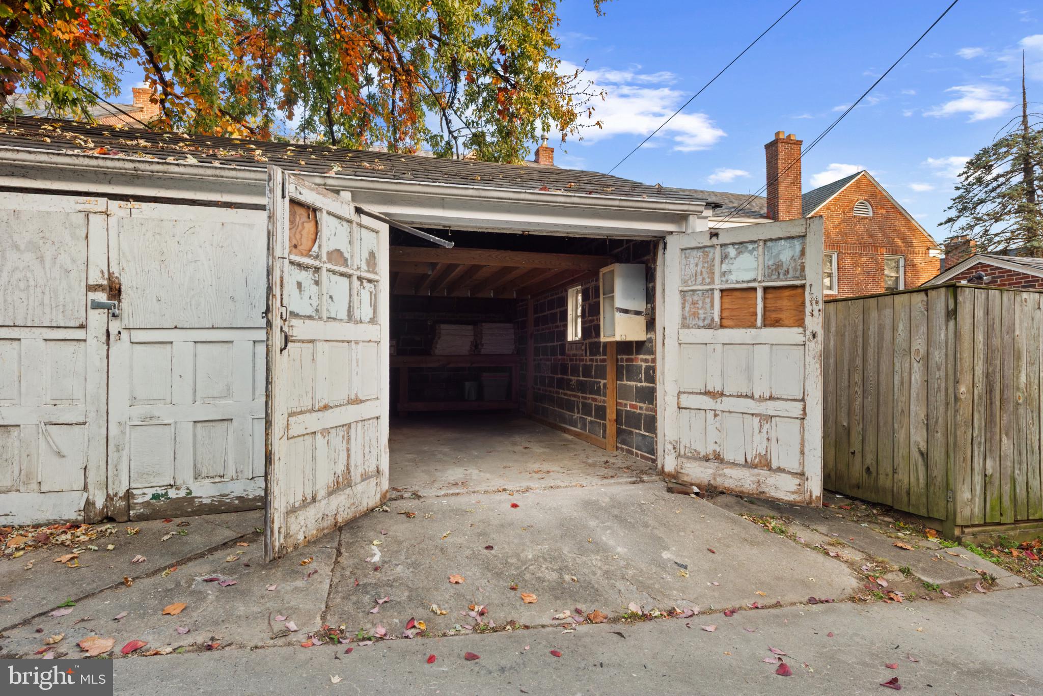 3712 Monterey Road Baltimore, MD 21218 - Photo 35 of 40 a view of a house with a wooden fence
