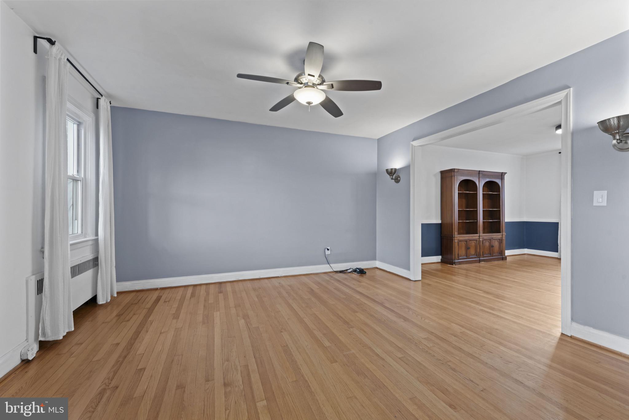 3712 Monterey Road Baltimore, MD 21218 - Photo 6 of 40 wooden floor in an empty room with a window