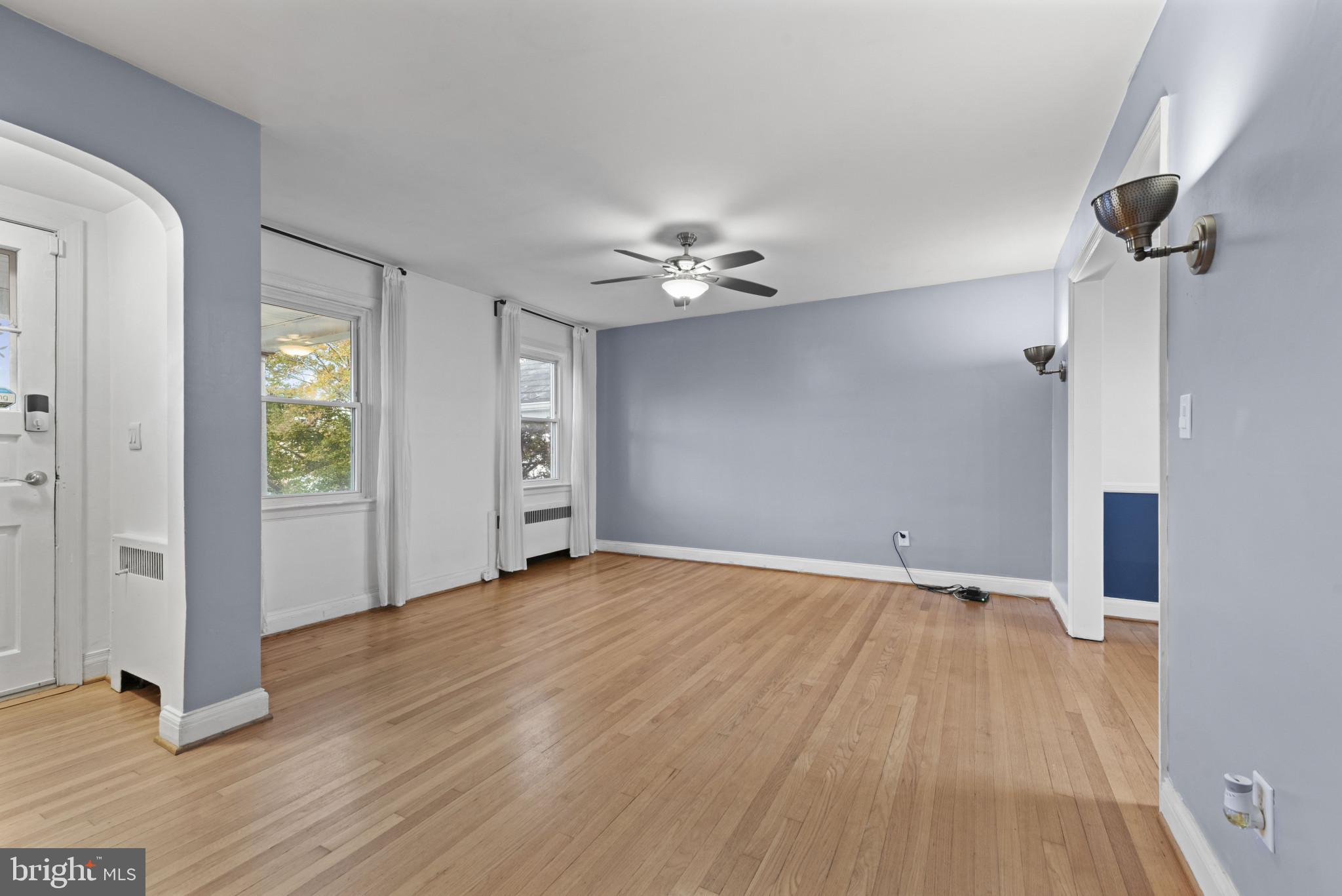 3712 Monterey Road Baltimore, MD 21218 - Photo 7 of 40 wooden floor in an empty room with a window
