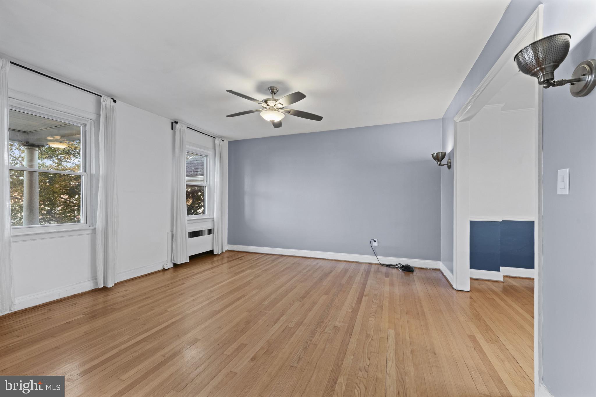 3712 Monterey Road Baltimore, MD 21218 - Photo 8 of 40 wooden floor in an empty room with a window