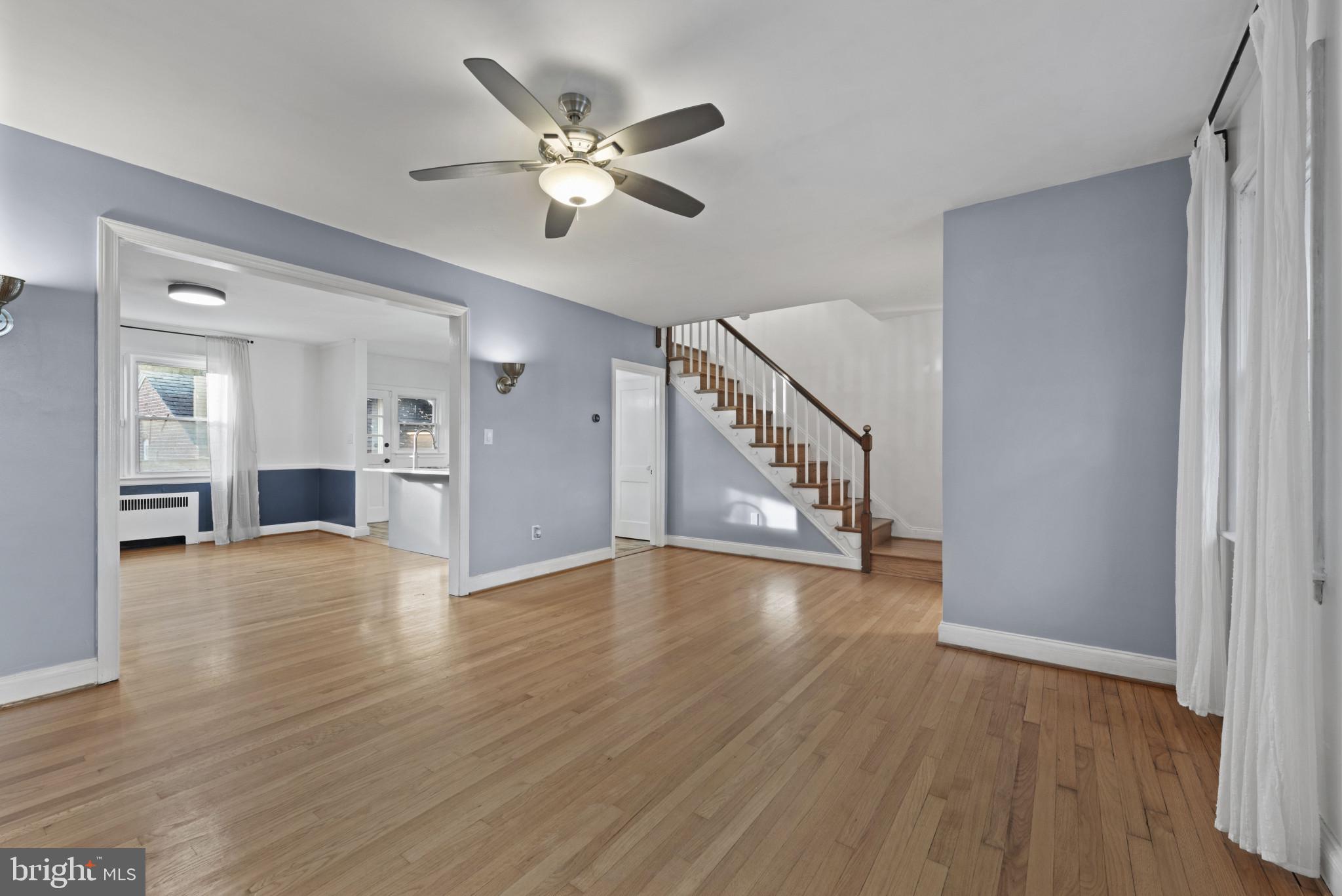 3712 Monterey Road Baltimore, MD 21218 - Photo 9 of 40 a view of an empty room with wooden floor and a window