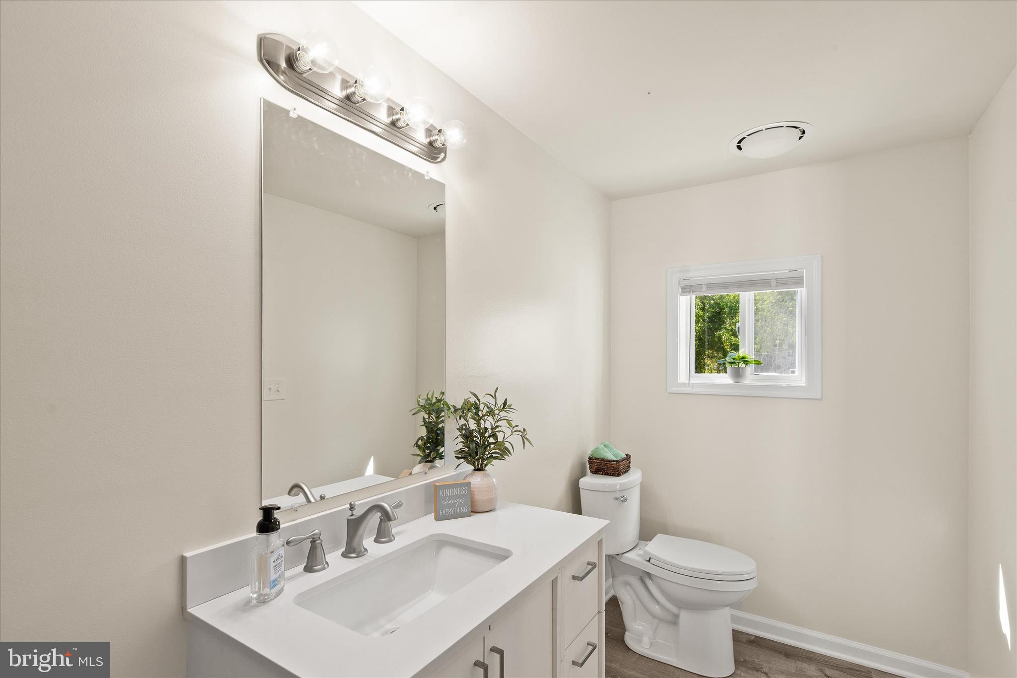 26465 Mason Webster Road Princess Anne, MD 21853 - Photo 19 of 56 a bathroom with a toilet sink and mirror