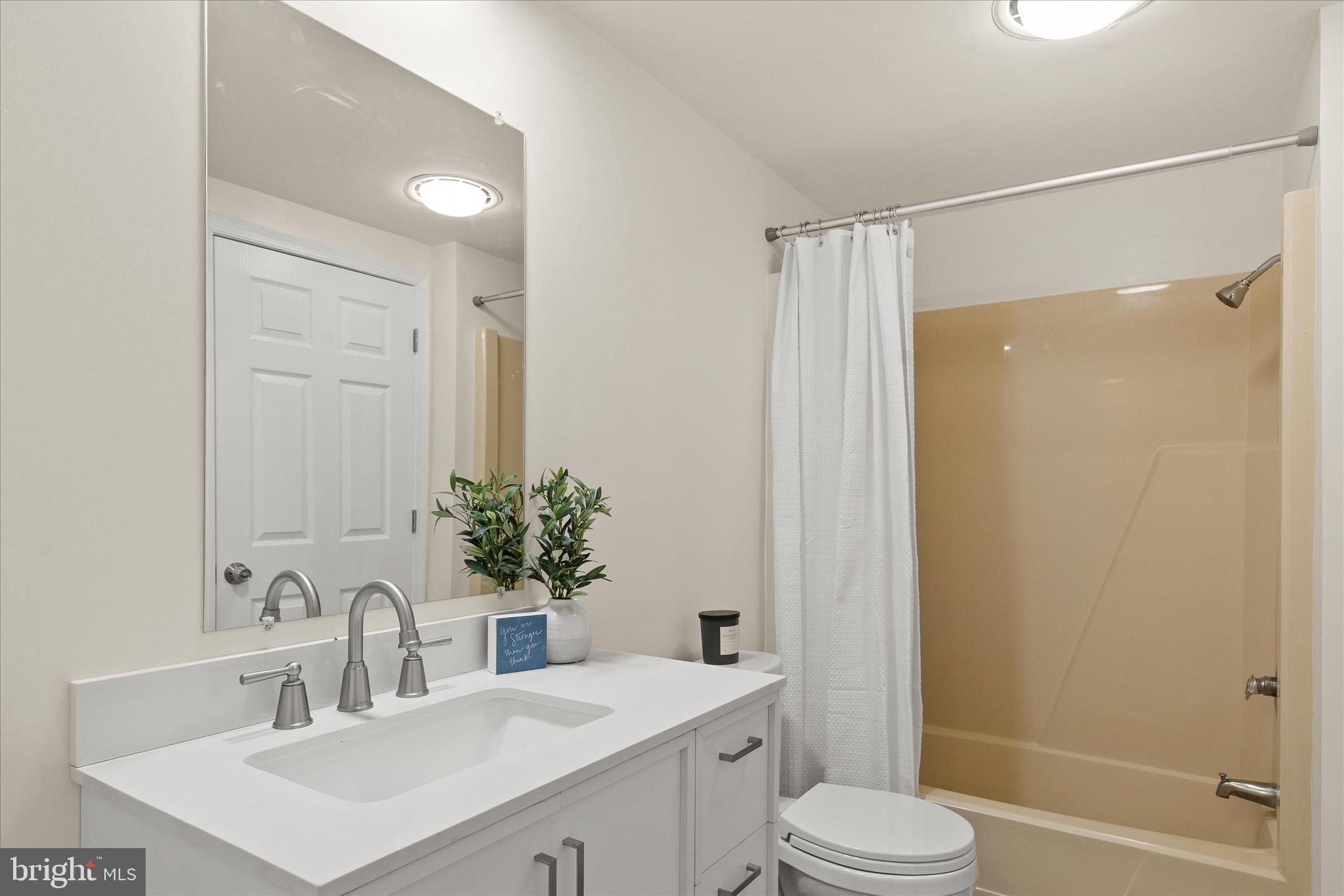 26465 Mason Webster Road Princess Anne, MD 21853 - Photo 28 of 56 a bathroom with a sink toilet and shower