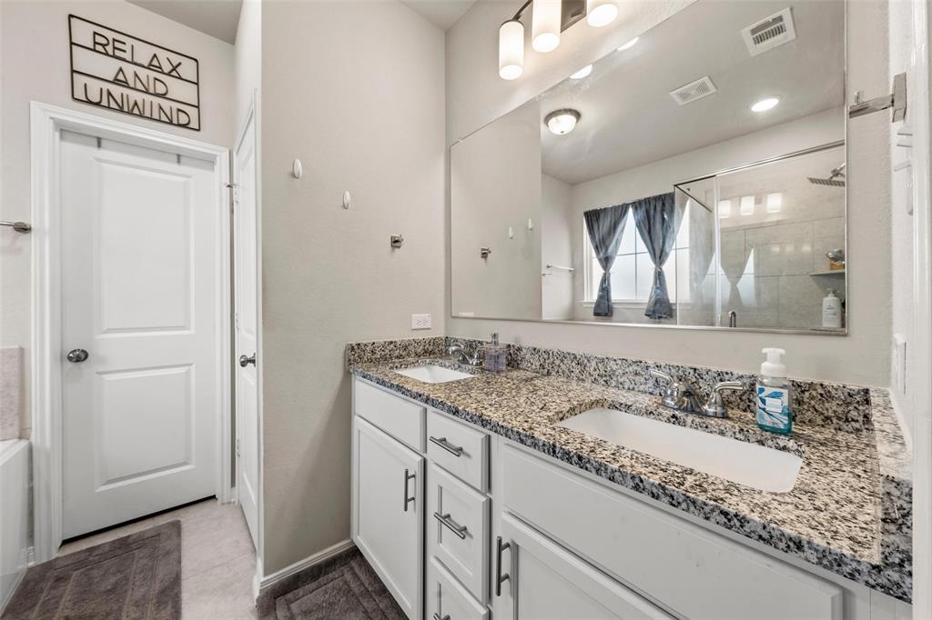 3525 Beutel Road Lorena, TX 76655 - Photo 12 of 34 a bathroom with a granite countertop sink and a mirror