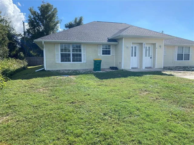 a house that has a big yard in front of it