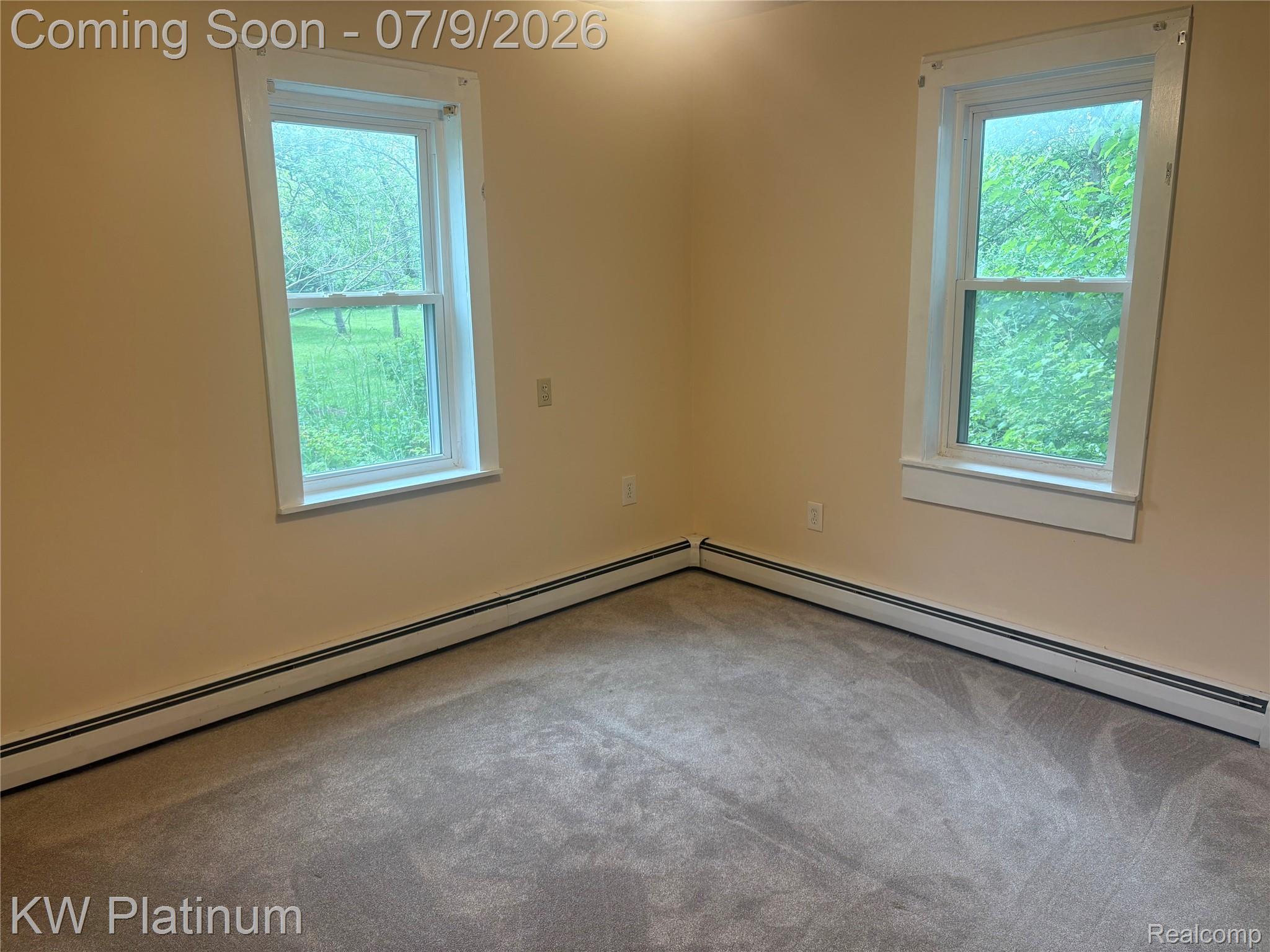 7280 North Road Fort Gratiot, MI 48059 - Photo 28 of 40 Neutral-toned carpeting extends throughout this room, complemented by light beige wall paint