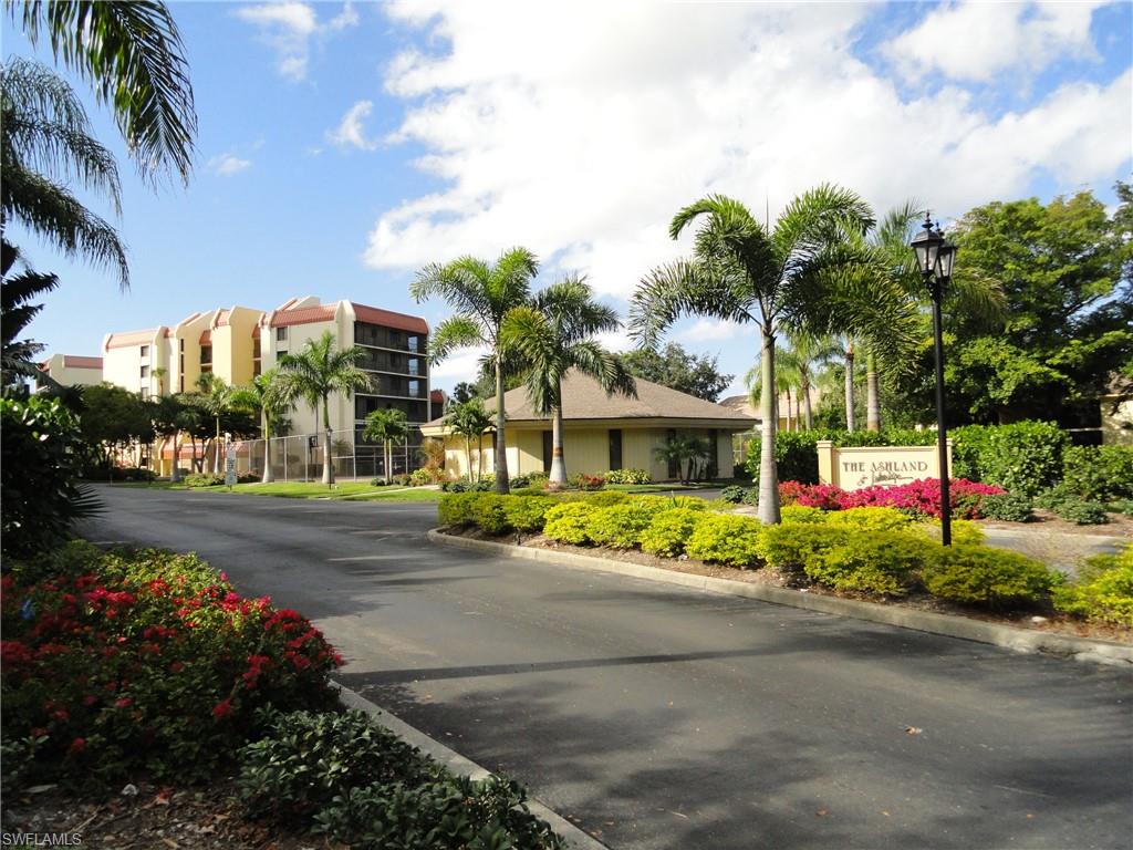 7119 Lakeridge View Court, Unit 302 Fort Myers, FL 33907 - Photo 1 of 44 a front view of a house with a yard and a garden