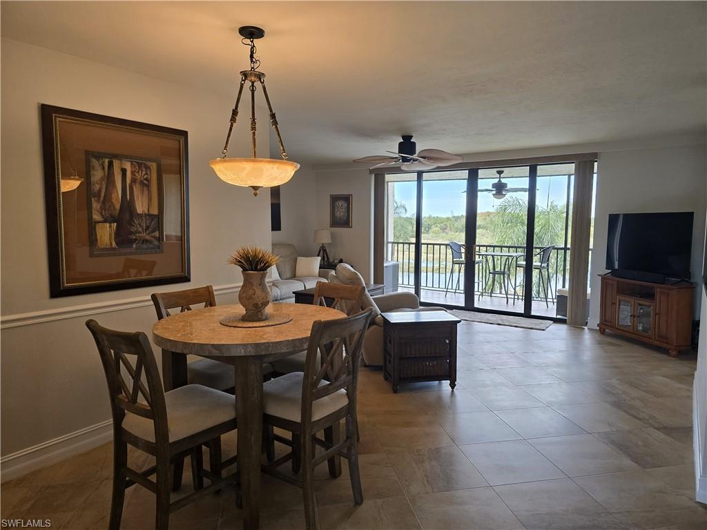 7119 Lakeridge View Court, Unit 302 Fort Myers, FL 33907 - Photo 21 of 44 a view of a dining room with furniture window and outside view