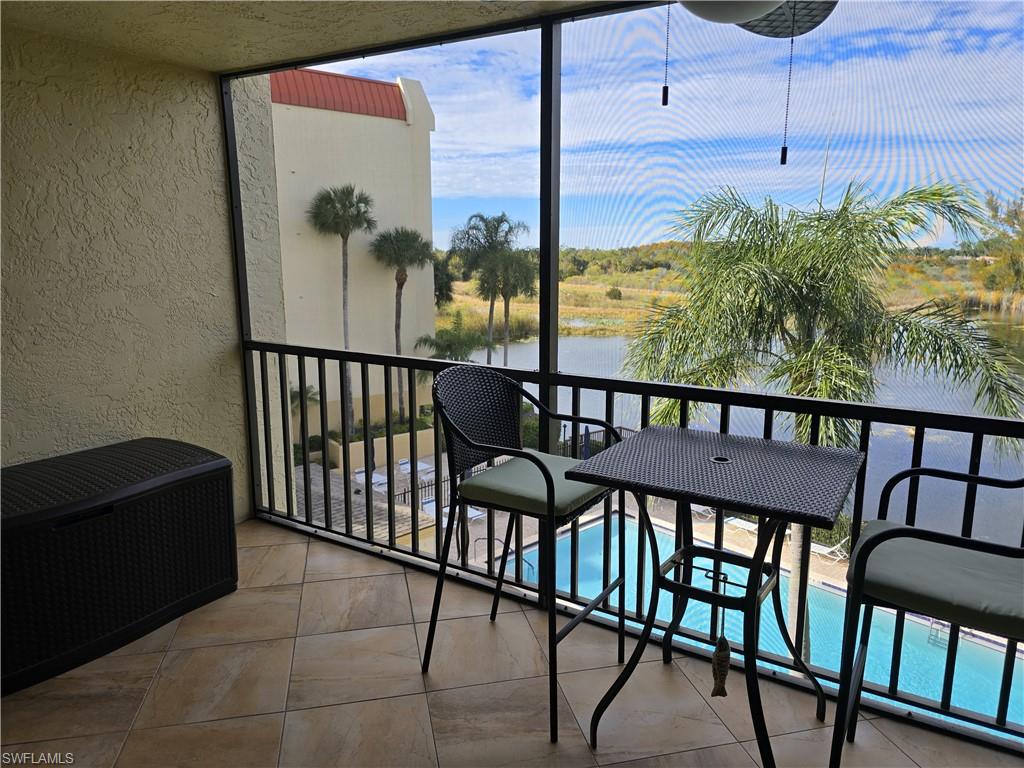 7119 Lakeridge View Court, Unit 302 Fort Myers, FL 33907 - Photo 24 of 44 a view of a balcony with chairs