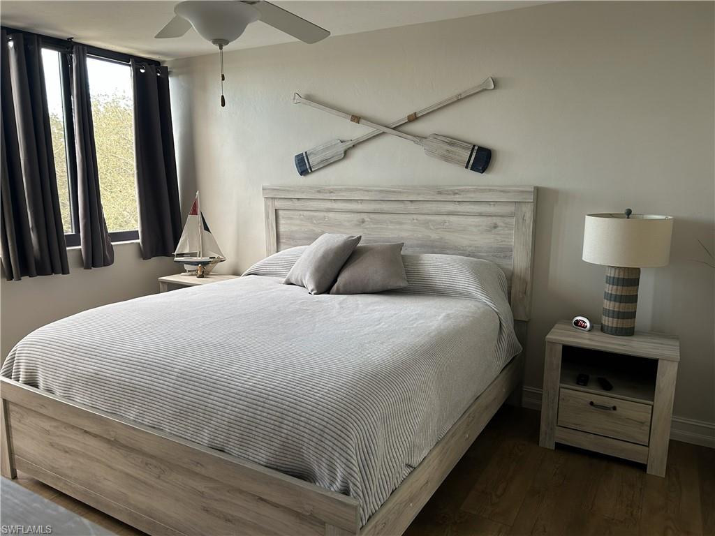 7119 Lakeridge View Court, Unit 302 Fort Myers, FL 33907 - Photo 29 of 44 a bedroom with a bed and a tv on table