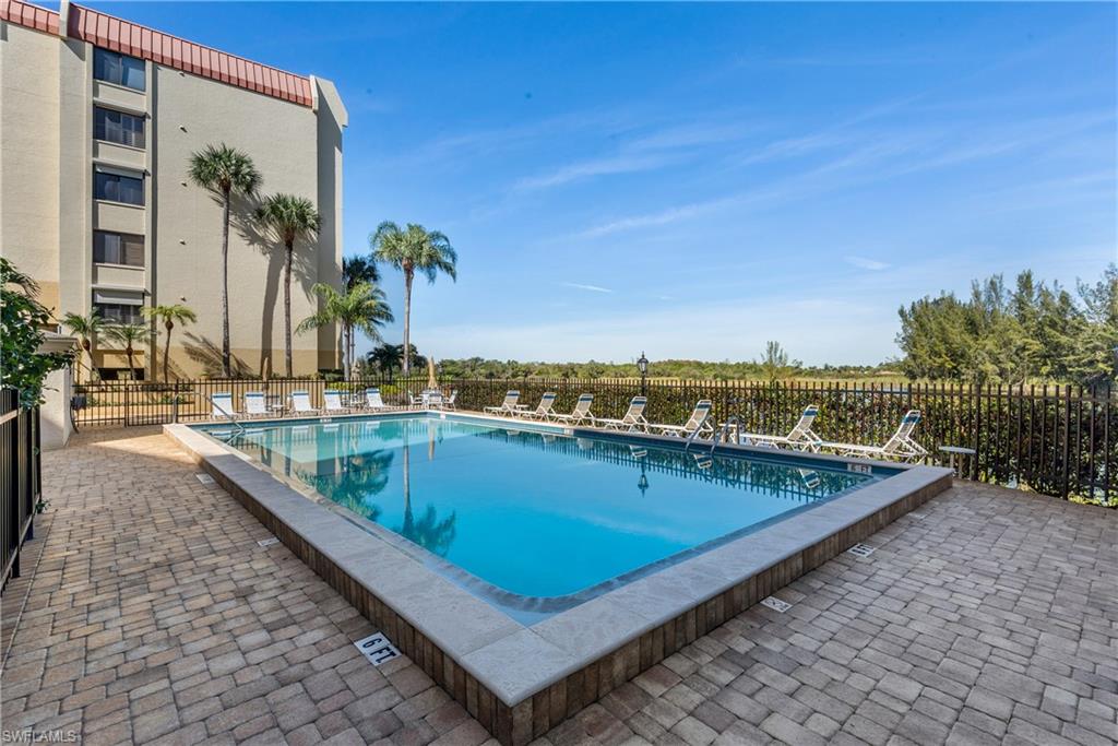 7119 Lakeridge View Court, Unit 302 Fort Myers, FL 33907 - Photo 42 of 44 swimming pool with an outdoor seating