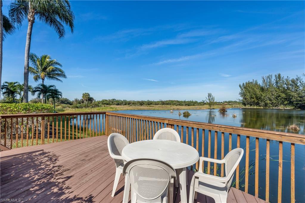 7119 Lakeridge View Court, Unit 302 Fort Myers, FL 33907 - Photo 44 of 44 a view of a roof deck with chair and wooden floor