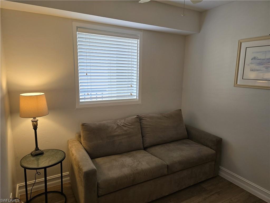 7119 Lakeridge View Court, Unit 302 Fort Myers, FL 33907 - Photo 5 of 44 a living room with furniture and a lamp