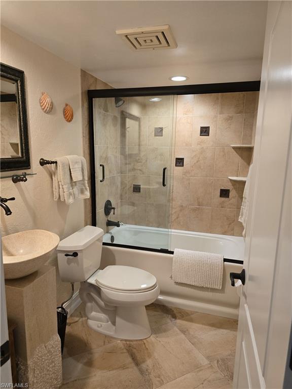 7119 Lakeridge View Court, Unit 302 Fort Myers, FL 33907 - Photo 9 of 44 a bathroom with a toilet sink and shower