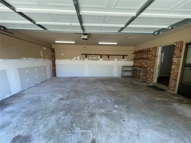 a view of empty room with wooden ceiling