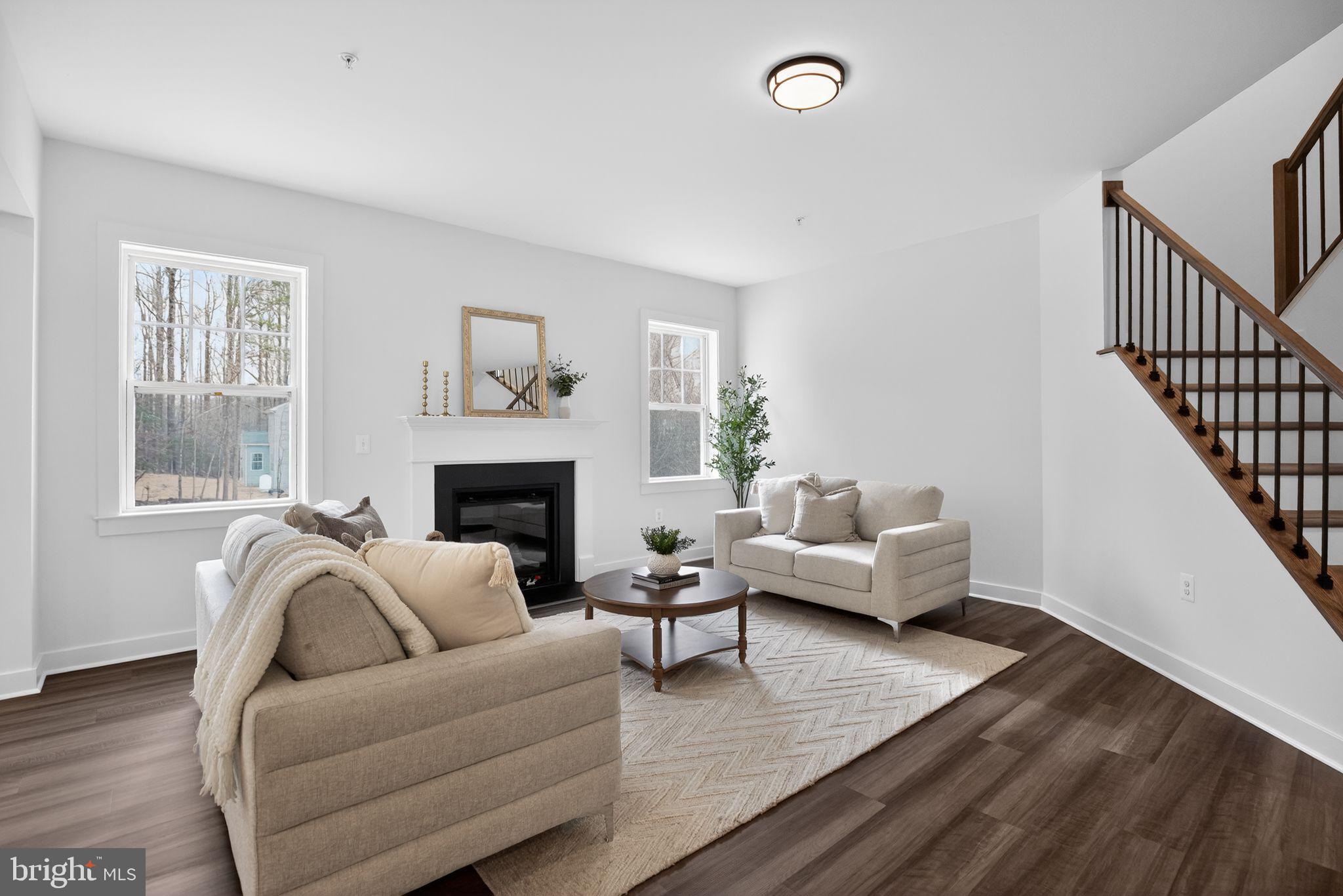 1975 Dares Beach Road Prince Frederick, MD 20678 - Photo 12 of 30 a living room with furniture and a fireplace