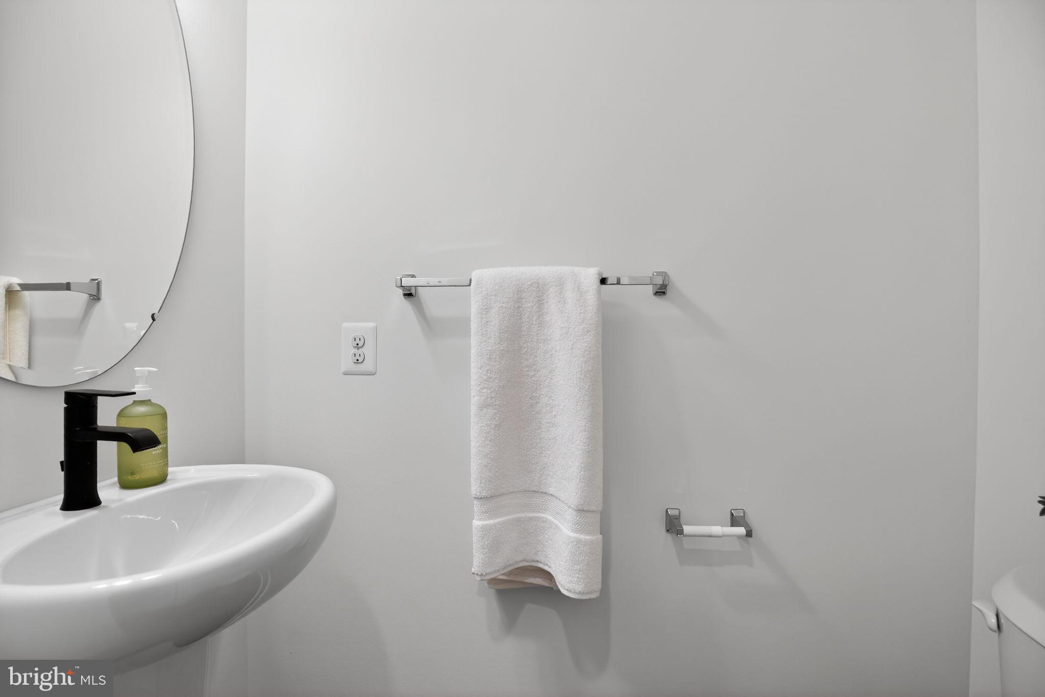 1975 Dares Beach Road Prince Frederick, MD 20678 - Photo 14 of 30 a bathroom with a sink and a mirror