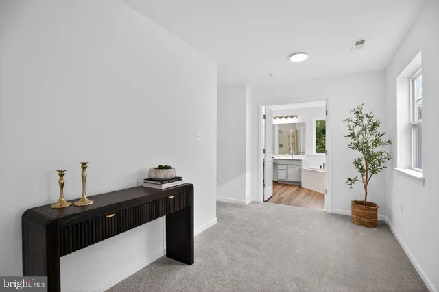 a bedroom with a bed and lamp