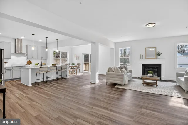 a view of a dining room with furniture and a livingroom