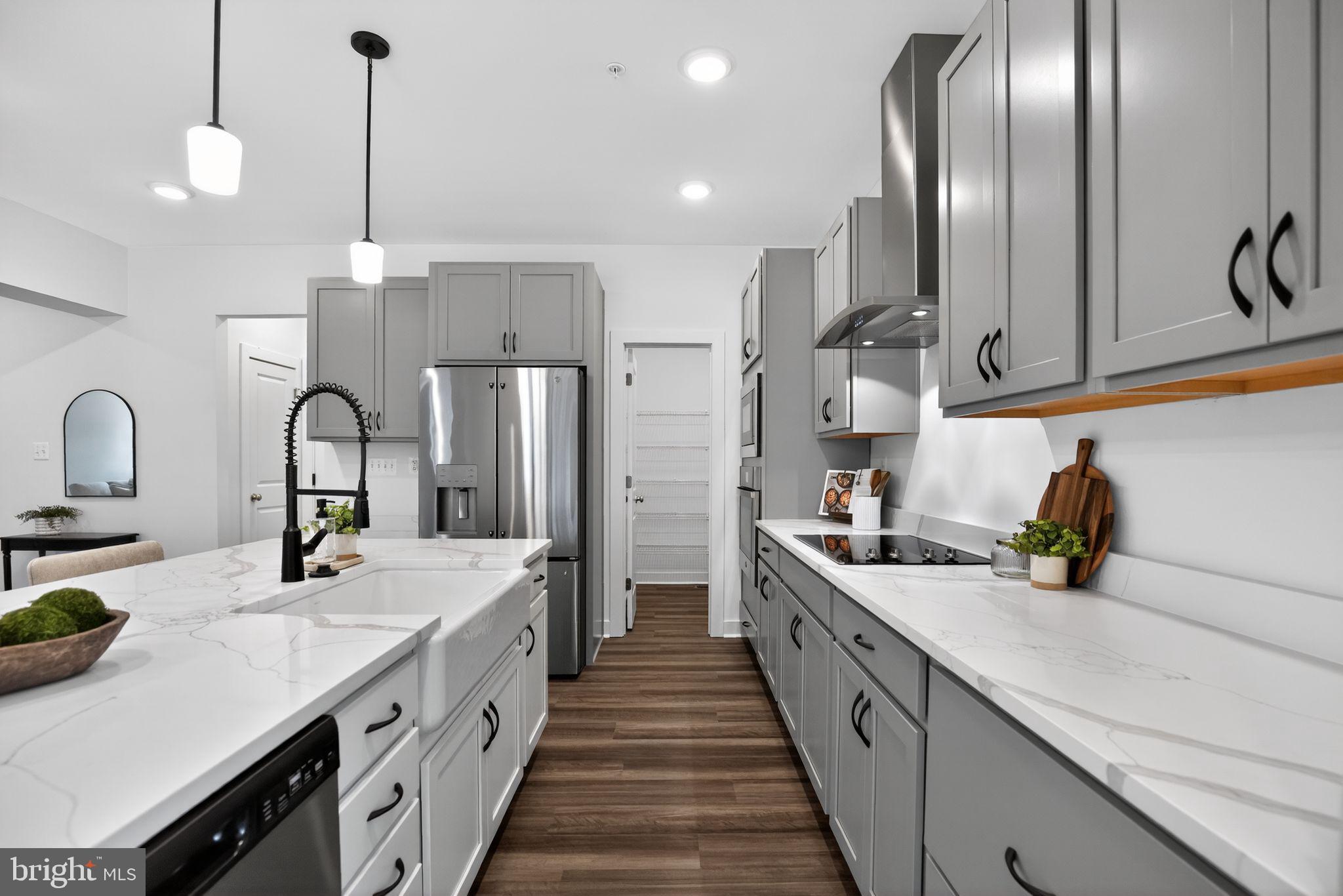 1975 Dares Beach Road Prince Frederick, MD 20678 - Photo 9 of 30 a kitchen with stainless steel appliances a sink stove and refrigerator