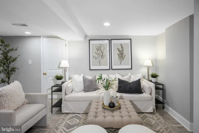 a living room with furniture and window
