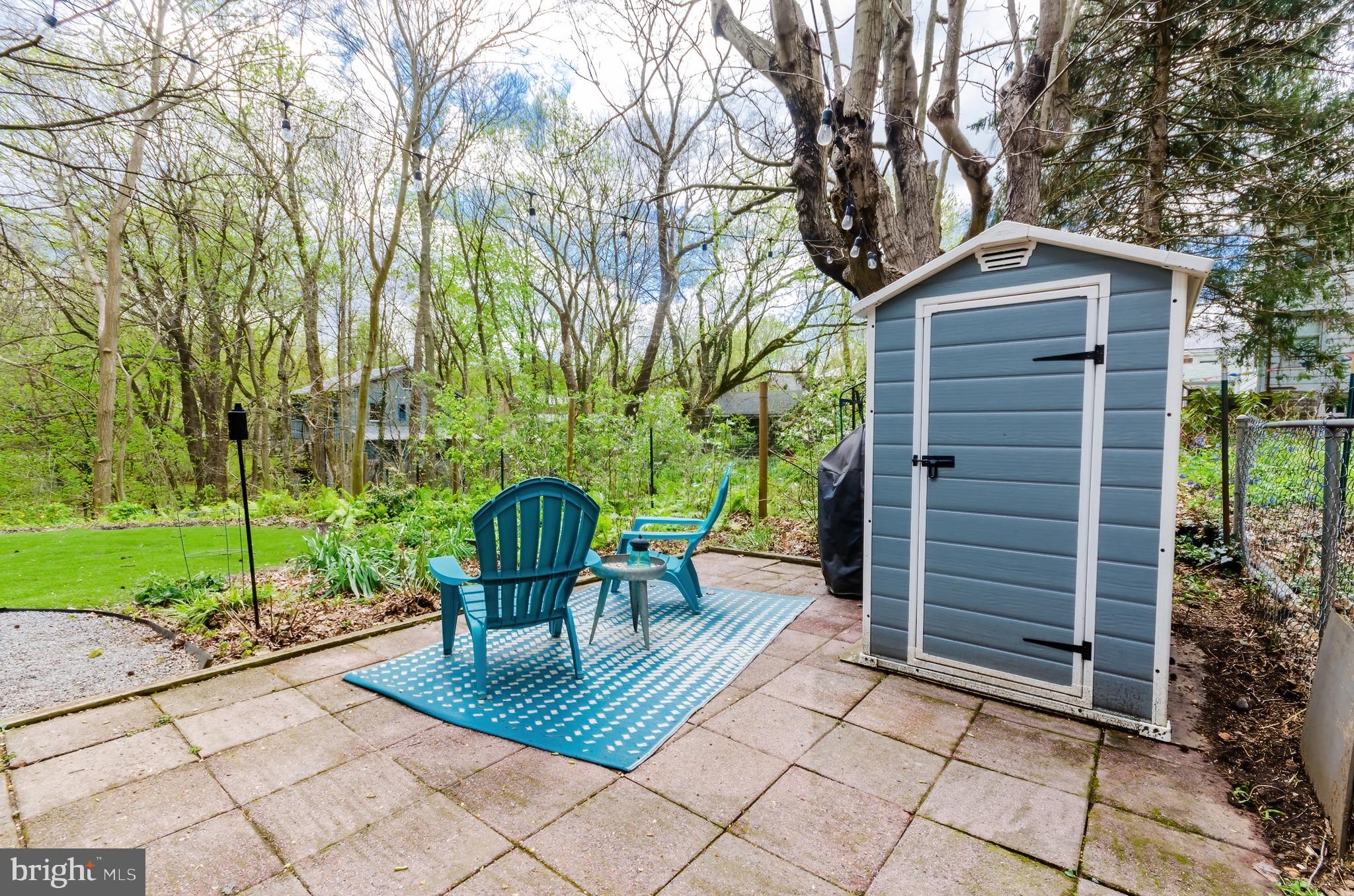 207 North Princess Street Shepherdstown, WV 25443 - Photo 22 of 26 a backyard of a house with table and chairs