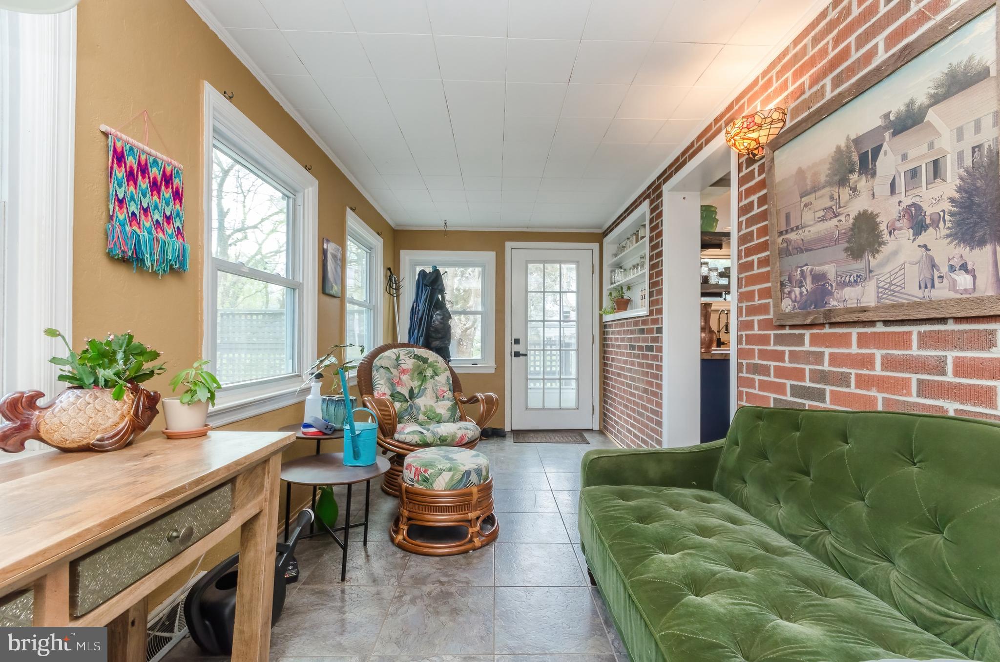 207 North Princess Street Shepherdstown, WV 25443 - Photo 6 of 26 a living room filled with furniture and a floor to ceiling window