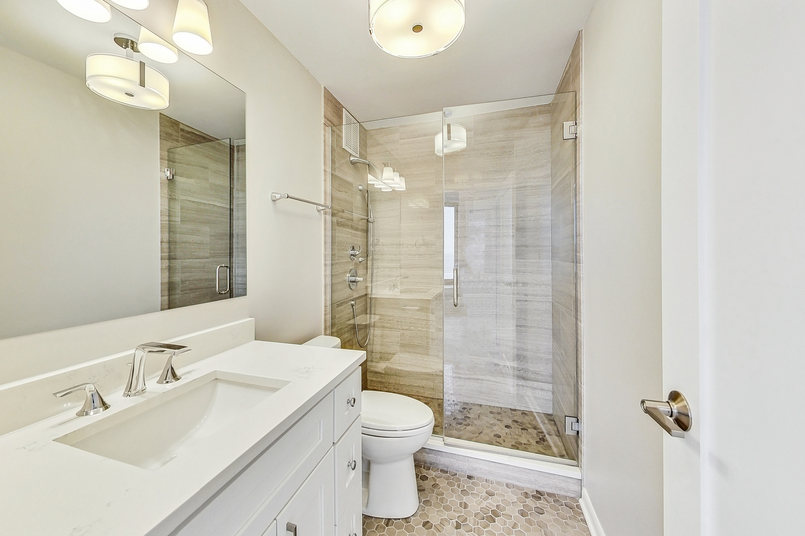 155 North Harbor Drive, Unit 4804 Chicago, IL 60601 - Photo 13 of 31 a bathroom with a sink a toilet and shower