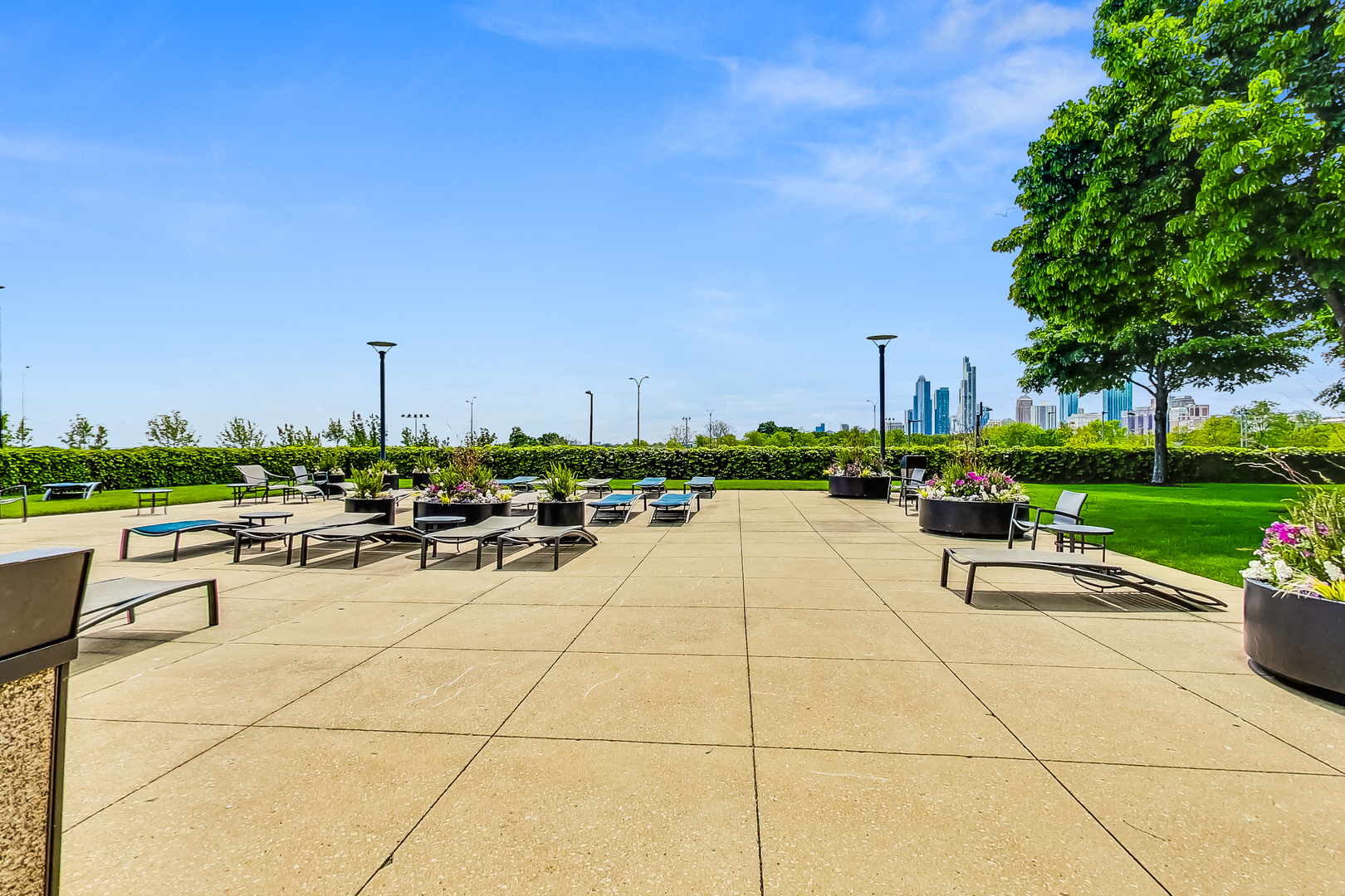 155 North Harbor Drive, Unit 4804 Chicago, IL 60601 - Photo 28 of 31 a view of a patio with a dining table and chairs